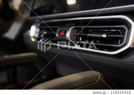 Closeup of car dashboard air vents near gear shift Closeup of car dashboard air vents near gear shift 119335418