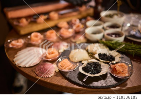 Enjoy a beautifully crafted Seafood Platter with various delicacies for a delightful experience Enjoy a beautifully crafted Seafood Platter with various delicacies for a delightful experience 119336185