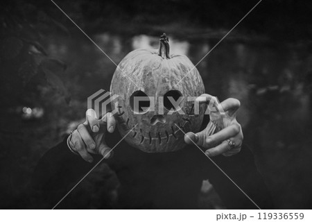 Scary man with pumpkin head for Halloween. Jack-o-lantern costume.Trick or treat, scares you, playing in horror stories 119336559