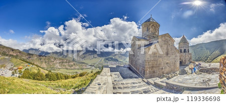 Gergeti Trinity Church near Stepantsminda, Georgia, with stunning views of the Caucasus mountains 119336698