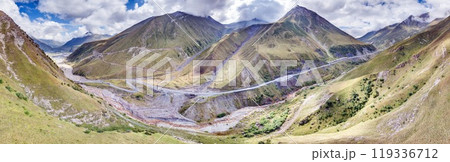 Drone view of the Cross Pass in Georgia, showcasing winding roads and mountainous terrain Drone view of the Cross Pass in Georgia, showcasing winding roads and mountainous terrain 119336712
