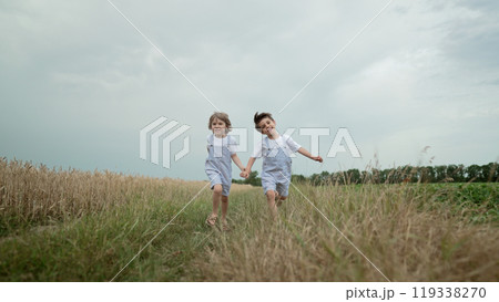 Little Happy Children Boys Running Race Outside City, Natural Rural Landscape Little Happy Children Boys Running Race Outside City, Natural Rural Landscape 119338270