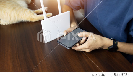 Holiday concept man using wifi router to connect to internet network 119339722