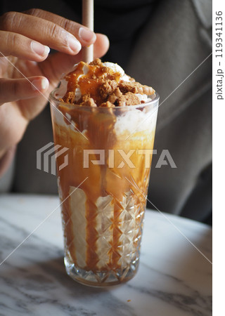 Indulge in a Delicious and Luxurious Layered Coffee Dessert Generously Topped with Treats Indulge in a Delicious and Luxurious Layered Coffee Dessert Generously Topped with Treats 119341136