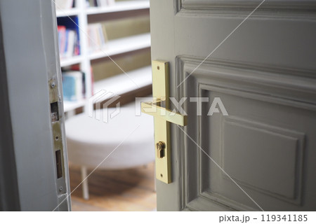 open door concept with Door handle and blur interior room background, open door concept with Door handle and blur interior room background, 119341185