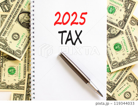 Planning 2025 tax new year symbol. Concept words 2025 Tax on beautiful white note. Beautiful background from dollar bills. Black pen. Business 2025 tax new year concept. Copy space. 119344033