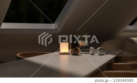 A close-up of a table with armchairs by the starlight window in a contemporary room at night. 119348393
