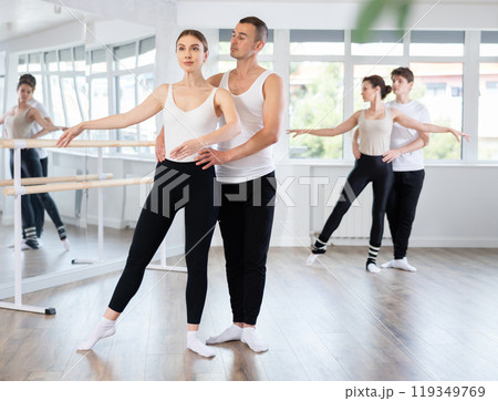 Young man and young woman rehearsing pair ballet Young man and young woman rehearsing pair ballet 119349769
