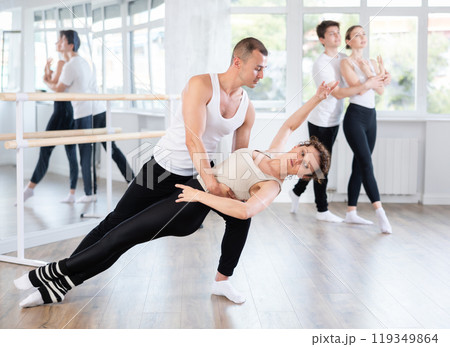 Young man and adult woman rehearsing pair ballet 119349864