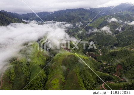Landscape of Morning Mist with Mountain Layer. mountain ridge and clouds in rural jungle bush forest Landscape of Morning Mist with Mountain Layer. mountain ridge and clouds in rural jungle bush forest 119353082