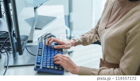 close up  developer hand coding with keyboard on desk  at modern office 119357172
