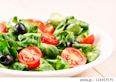 Mixed salad on a plate Mixed salad on a plate 119357575