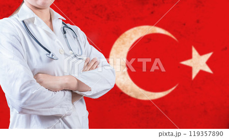 Healthcare concept with Turkish flag in background. Portrait of doctor with crossed arms with Turkish flag in the background 119357890