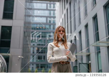 A Professional Woman Working in a Contemporary Office Environment with Modern Design Elements A Professional Woman Working in a Contemporary Office Environment with Modern Design Elements 119358126