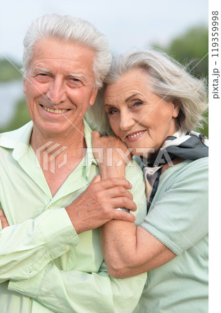 Portrait of beautiful senior couple posing in the park Portrait of beautiful senior couple posing in the park 119359998