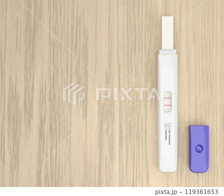 Pregnancy test on a wooden desk 119361653