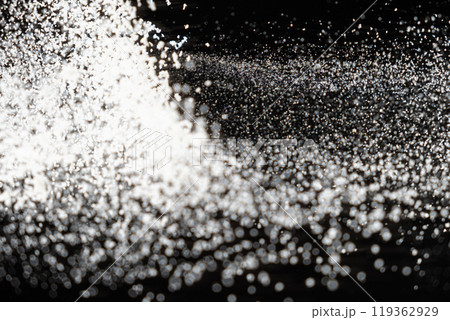 Abstract black and white background of pouring flour, space for text Abstract black and white background of pouring flour, space for text 119362929
