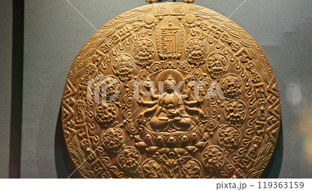 Bronze Mandala Of Akshobhya - One Of Dhyani Buddhas. Mandala Is Most Revered Symbol Of Tibetan Religion. Mandala Symbolizes The Mind And Body Of Buddha. Invariably Each Mandala Consists Of Presiding Bronze Mandala Of Akshobhya - One Of Dhyani Buddhas. Mandala Is Most Revered Symbol Of Tibetan Religion. Mandala Symbolizes The Mind And Body Of Buddha. Invariably Each Mandala Consists Of Presiding 119363159