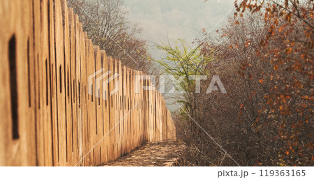 Jaipur, Rajasthan, India. Close-up View On Fortress Wall Surrounding Amer Fort Or Amber Fort, Amer Situated On Forested Hill. Great Example Of Rajput Architecture. Amber Fort Principal Tourist 119363165