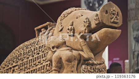 Close-up View On Varaha - Colossal Boar Is Third Incarnation Of Lord Vishnu. Varaha Is Depicted As Boar Or In Anthropomorphic Form, With Boar's Head And Human Body. His Consort, Bhumi Is Generally Close-up View On Varaha - Colossal Boar Is Third Incarnation Of Lord Vishnu. Varaha Is Depicted As Boar Or In Anthropomorphic Form, With Boar's Head And Human Body. His Consort, Bhumi Is Generally 119363176