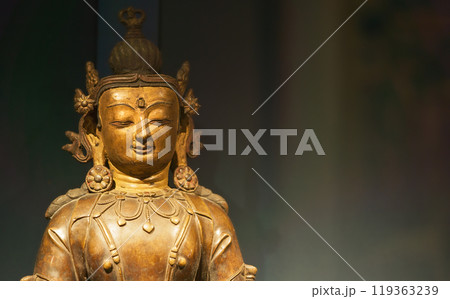 Close-up view on Gilt Bronze Statue Of Vairocana -also Mahavairocana- Is Cosmic Buddha From Mahayana And Vajrayana Buddhism. In Conception Of Five Jinas Of Mahayana And Vajrayana Buddhism, Vairocana Close-up view on Gilt Bronze Statue Of Vairocana -also Mahavairocana- Is Cosmic Buddha From Mahayana And Vajrayana Buddhism. In Conception Of Five Jinas Of Mahayana And Vajrayana Buddhism, Vairocana 119363239
