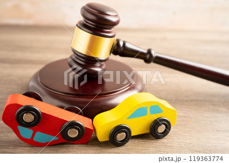 Hammer gavel judge with car vehicle accident, insurance coverage claim lawsuit court case. 119363774