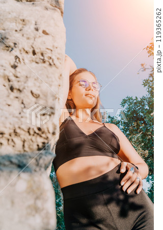 Woman, Sportswear, Tree, A woman in sportswear leans against a tree, enjoying the sunlight. 119365262