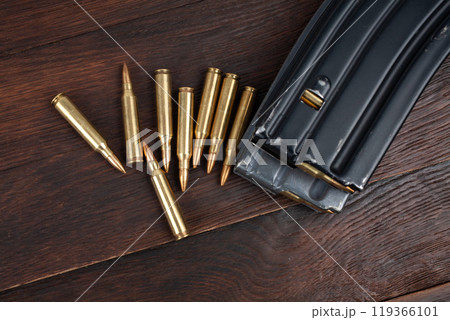 Ammunition with magazine on wooden table Ammunition with magazine on wooden table 119366101
