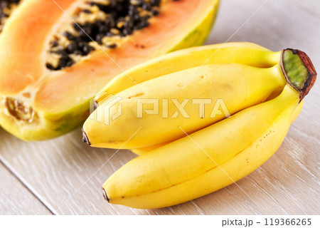 Bunch of Bananas and Papaya Isolated on a Background Bunch of Bananas and Papaya Isolated on a Background 119366265