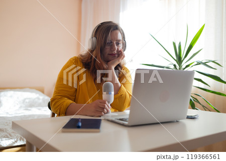 Tired stressed business woman feeling strong headache exhausted from overwork from pain in head or chronic migraine in home office 119366561