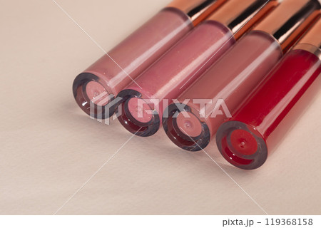 Lip gloss with applicator in light tubes. Cosmetic accessories. 119368158