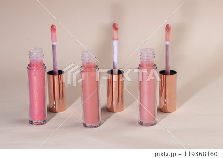 Lip gloss with applicator in light tubes. Cosmetic accessories. 119368160