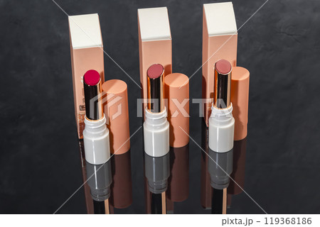 colored lipstick in light tubes. Cosmetic accessories. 119368186