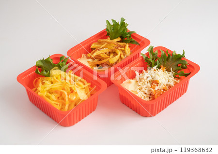 Assorted Salads and Fries in Red Containers 119368632