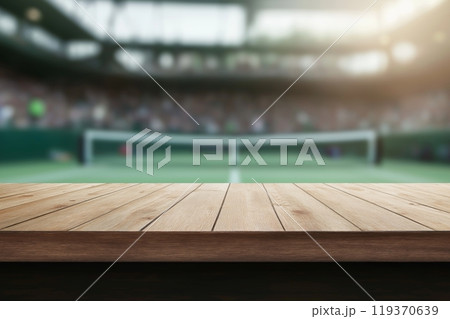 A wooden surface in the foreground with a blurred tennis court and stadium in the background 119370639