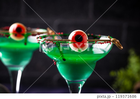 Spooky green Halloween cocktails with eyeballs Spooky green Halloween cocktails with eyeballs 119371686