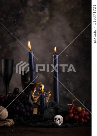 Halloween still life with skull, bones and cake Halloween still life with skull, bones and cake 119371721