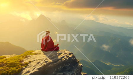 A monk meditating on top of a mountain, symbolizing the purification of the mind 119372263