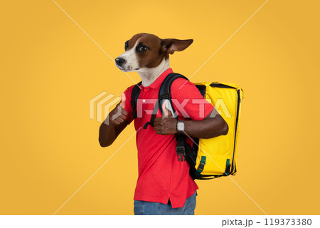 A dog-faced person wearing a red shirt and carrying a yellow delivery bag is giving a thumbs up with both hands while standing in front of a yellow background. A dog-faced person wearing a red shirt and carrying a yellow delivery bag is giving a thumbs up with both hands while standing in front of a yellow background. 119373380