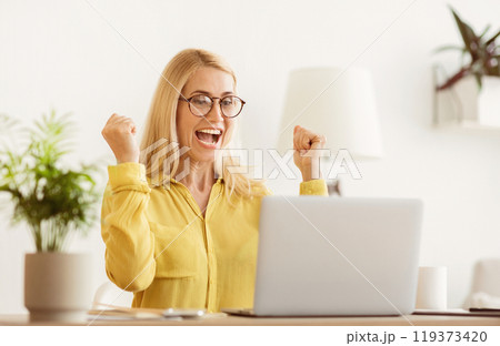 Happy Successful Businesswoman Triumphing With Laptop, Celebrating Victory In Office 119373420