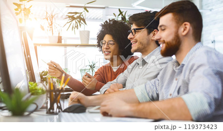 Group of young programmers developing data code, working together in modern office, panorama with free space Group of young programmers developing data code, working together in modern office, panorama with free space 119373423