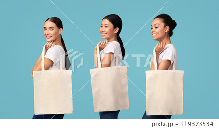 Say No To Plastic. Asian Woman Holding White Eco Shopper Bag Smiling Posing On Turquoise Studio Background. Free Space 119373534