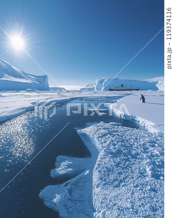 Lone emperor penguin stands on an ice floe in the antarctic, observing a cruise ship navigating a channel of deep blue water 119374116