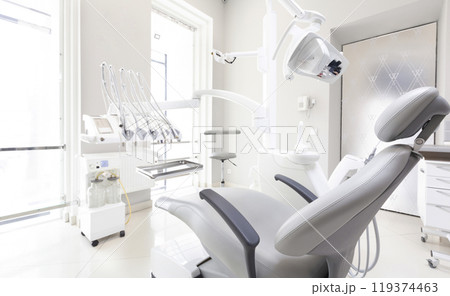 Dentist tools and professional dentistry chair in modern clinic, orthodontist room, copy space Dentist tools and professional dentistry chair in modern clinic, orthodontist room, copy space 119374463