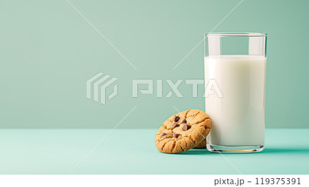 Glass of milk and cookies with chocolate chips on the table, copy space 119375391