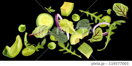 Vegetable salad isolated, falling rucola, lettuce, spinach leaves, sliced vegetables isolated on black background Vegetable salad isolated, falling rucola, lettuce, spinach leaves, sliced vegetables isolated on black background 119377003