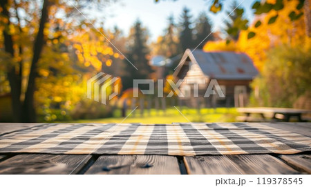 Empty wooden table with tablecloth in the autumn garden. Copy space. Generative AI 119378545