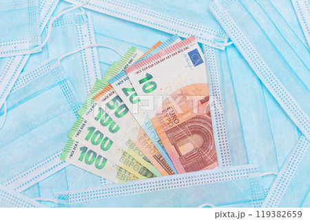 Euro Banknotes with Blue Disposable Medical Face Masks 119382659