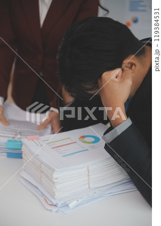 Audit concept,Administrator business man financial inspector and secretary making report calculating balance. Internal Revenue Service checking document. Audit concept,Administrator business man financial inspector and secretary making report calculating balance. Internal Revenue Service checking document. 119384531