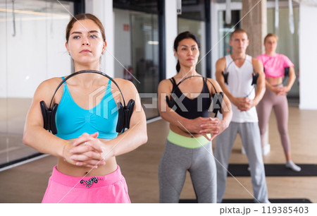 Young sporty woman exercising with pilates ring Young sporty woman exercising with pilates ring 119385403